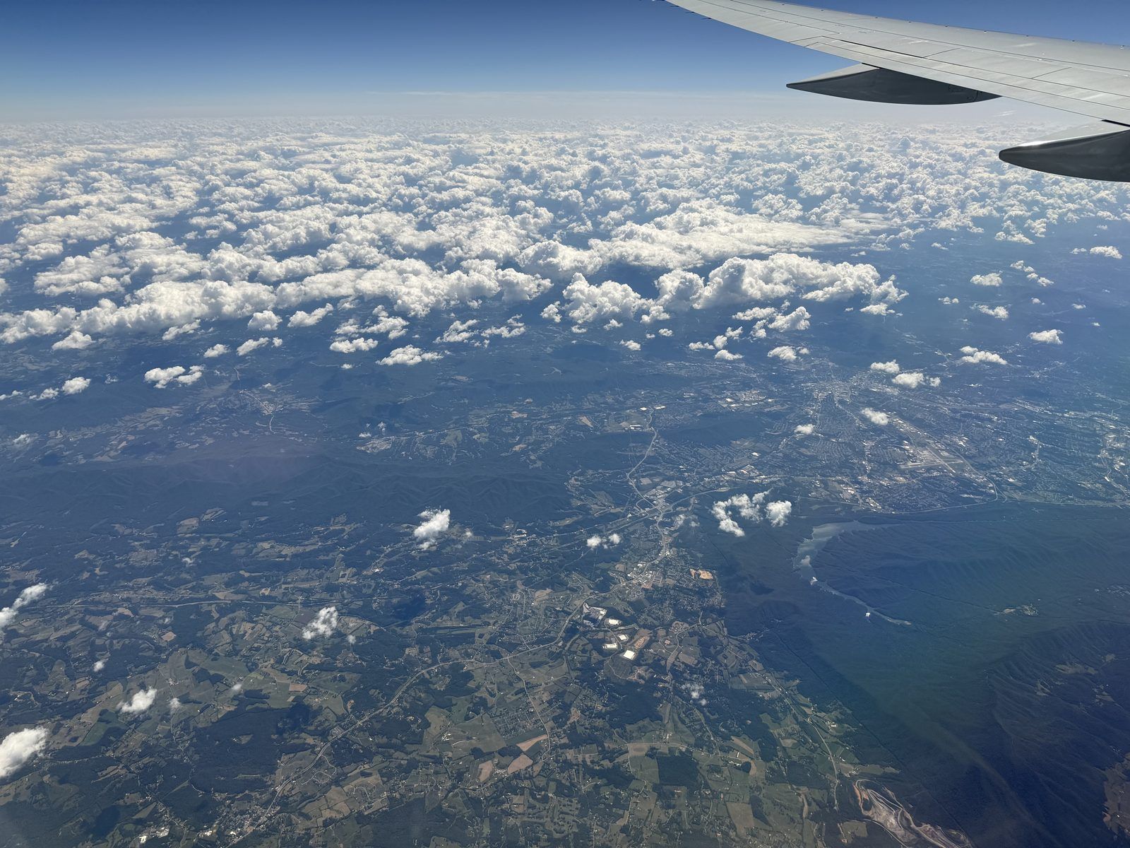 2025-09-12 13 14 40 Distant aerial view southeastward centered on southern Botetourt County, Virginia (with the city of Roanoke visible to the right) seen from an aircraft which departed from Newark Liberty International Airport